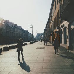 Full length of woman walking in city