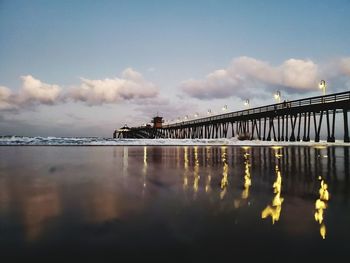 Bridge over sea against sky