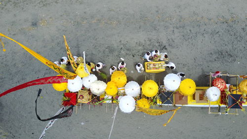 High angle view of yellow toy car on road