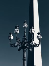 Low angle view of street light against sky