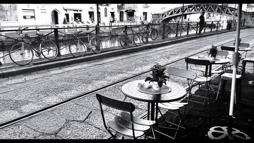 Man cycling on railing in city