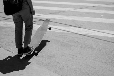 Low section of man skateboarding on skateboard