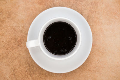 High angle view of black coffee on table