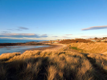 Scenic view of lossiemouth beach and sea against sky