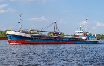 Boats in sea against sky