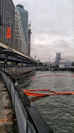 View of bridge over river against cloudy sky