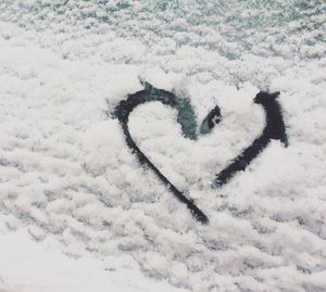 High angle view of heart shape on snow