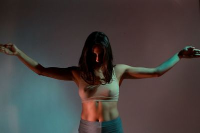 Young woman with arms outstretched