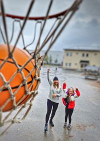 People celebrating basket throw 