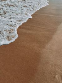 High angle view of surf on beach