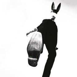 Man wearing mask against white background