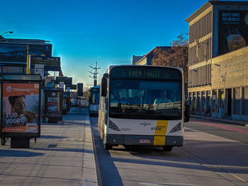 View of city street against blue sky