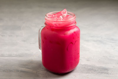 Close-up of drink in glass jar on table