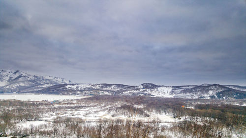 Scenic view of snowcapped mountains against sky