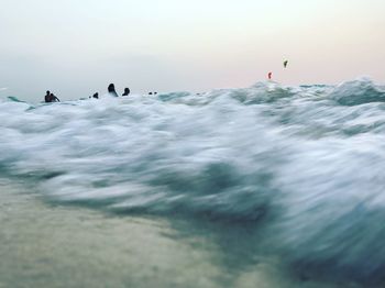 Blurred motion of waves reaching on shore at beach