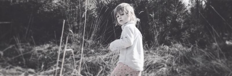 Girl standing on field