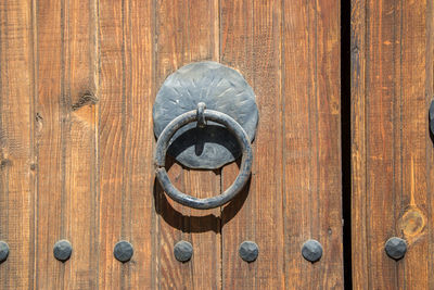 Close-up of wooden door knocker