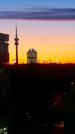 Silhouette cityscape against sky during sunset