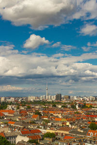 High angle view of city against cloudy sky