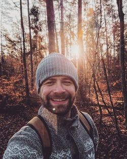 Portrait of smiling man in forest