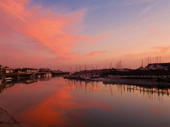 Sailboats in marina at sunset