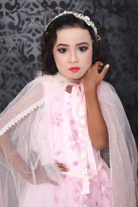 Portrait of cute girl wearing make-up