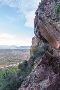 Rock formations on landscape against sky