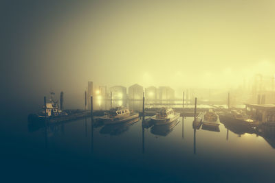 Boats in city at night