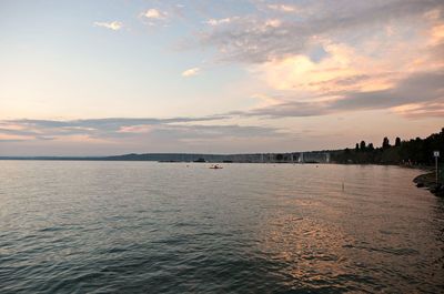 View of beach against cloudy sky
