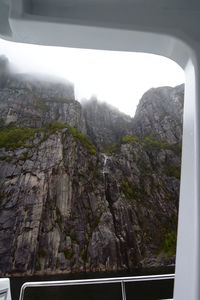 Scenic view of mountains seen through window