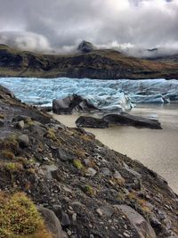 Scenic view of lake against sky during winter