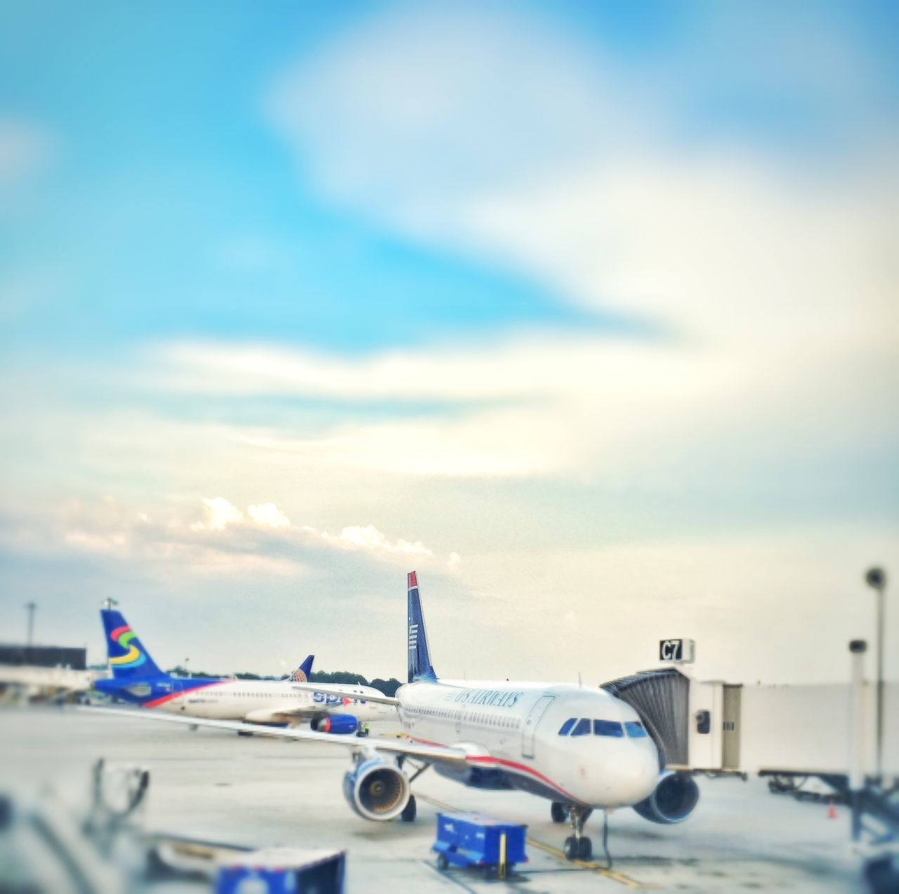 transportation, mode of transport, sky, nautical vessel, blue, cloud - sky, boat, moored, cloud, sea, day, outdoors, no people, travel, beach, nature, focus on foreground, airplane, air vehicle, cloudy