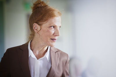 Mature businesswoman looking away