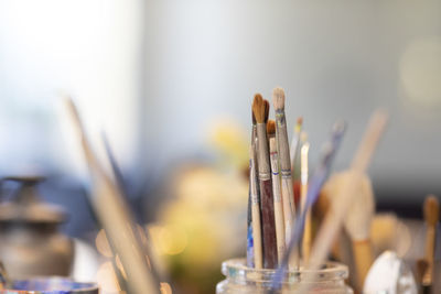 Close-up of paintbrushes on table