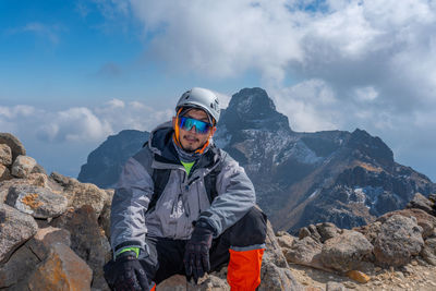 Rear view of man standing against mountain