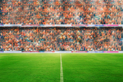 View of soccer field with people in background