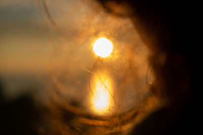 Close-up of illuminated sun during sunset