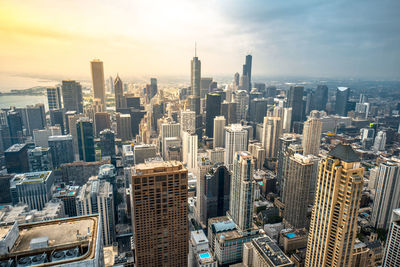 Aerial view of modern buildings in city against sky