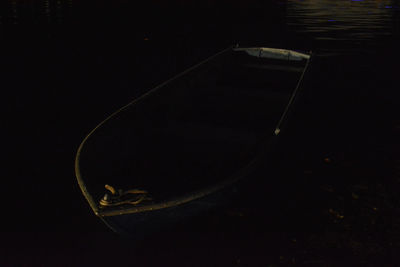 High angle view of reflection in water against black background