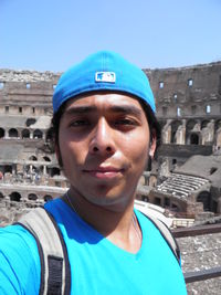 Portrait of young man against blue sky