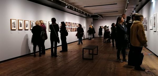 People walking in corridor of museum