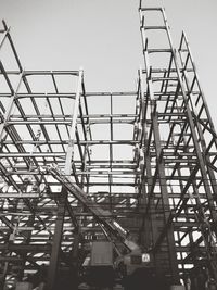 Low angle view of metallic structure against sky