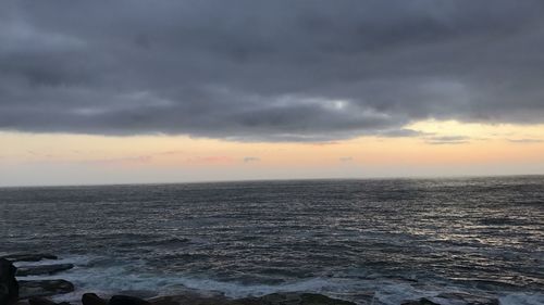 Scenic view of sea against sky at sunset