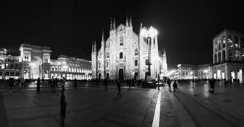 View of illuminated buildings in city at night