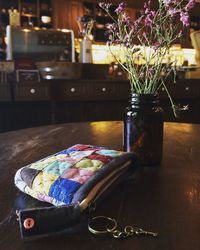 Close-up of flower vase on table at home