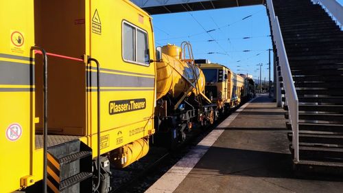 Train on railroad track against sky