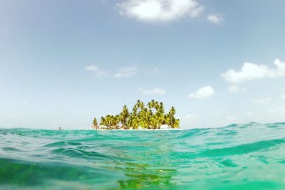 Scenic view of sea against cloudy sky