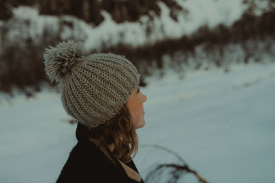 Side view of woman on snow