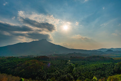 Scenic view of landscape and mountains against sky