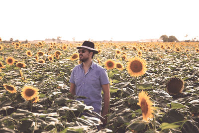 Full length of young man standing in land